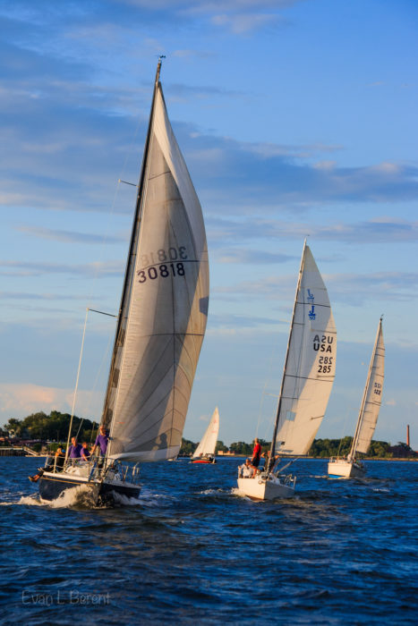 A racing fleet head to the finish line in Eastchester Bay, New York