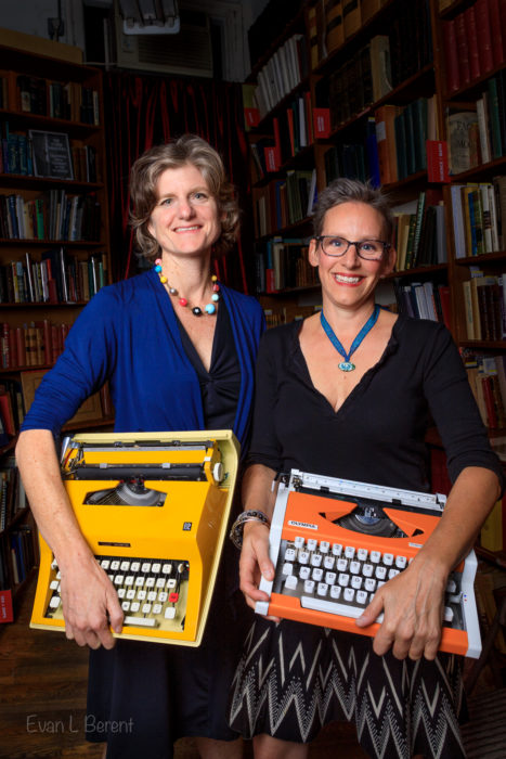 The Creative Caravan duo hold their typewriters while in the Strand, New York.