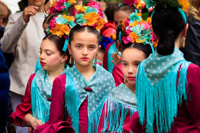 Girls dressed in a colorful Flamenca outfit during Corpus Cristi